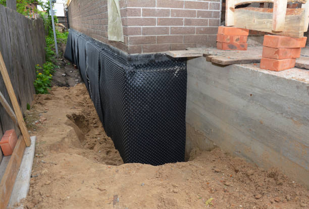 Happy homeowners after waterproofing job in Vallonia